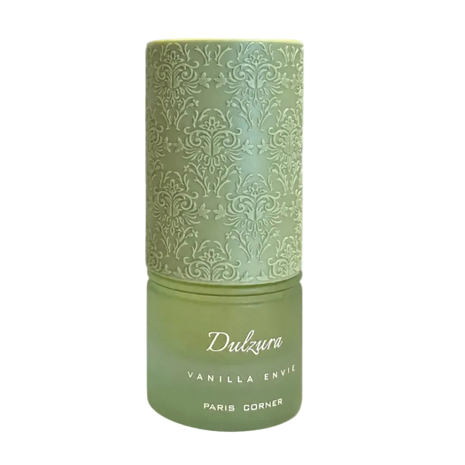A green cylindrical perfume sample vial with a matching embossed patterned cap, alongside two small clear spray sample bottles on a white background. The main bottle is labeled 'Dulzura VANILLA ENVIE PARIS CORNER'.