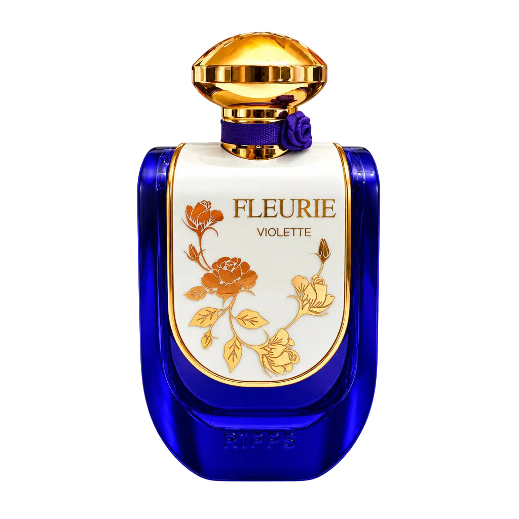 A purple and gold perfume bottle labeled 'FLEURIE VIOLETTE' with two small clear sample spray vials beside it, photographed on a plain white background.