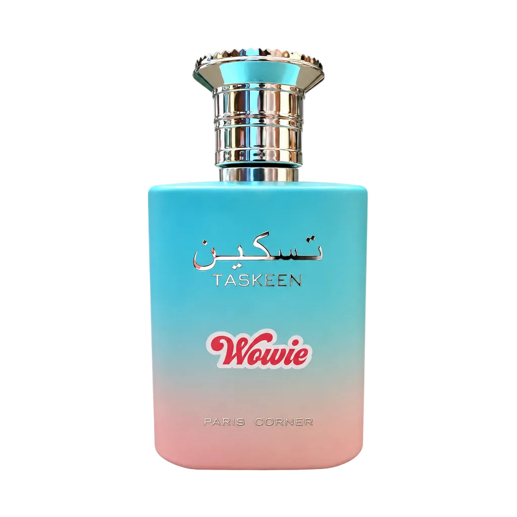 A bottle of Taskeen Wowie perfume with a blue-to-pink gradient body and silver cap, shown next to two small clear sample spray vials on a white background.