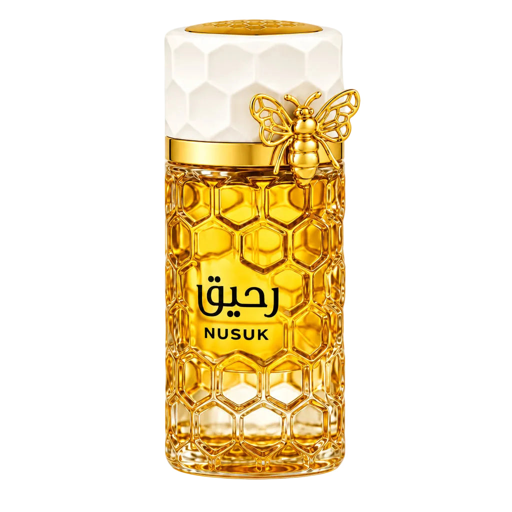 A honeycomb-patterned perfume bottle with a white cap and gold bee decoration, labeled 'Nusuk' in Arabic and English, shown with three clear sample spray vials on a white background.