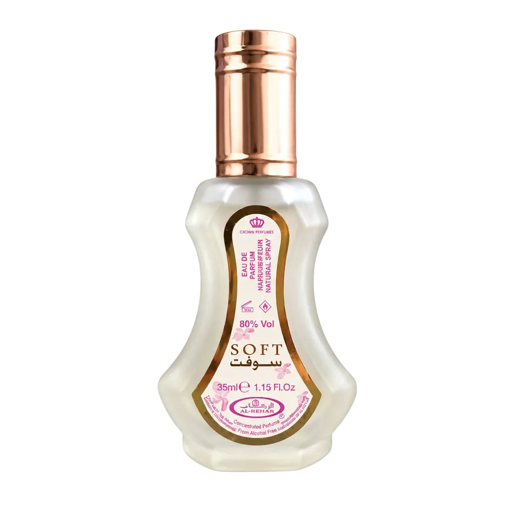 Perfume bottle with smaller sample bottles on a white background