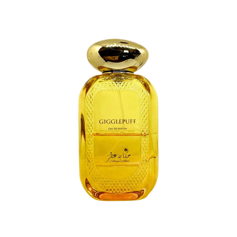 Gold perfume bottle labeled 'Gigglepuff' with smaller bottles and a spray nozzle on a white background